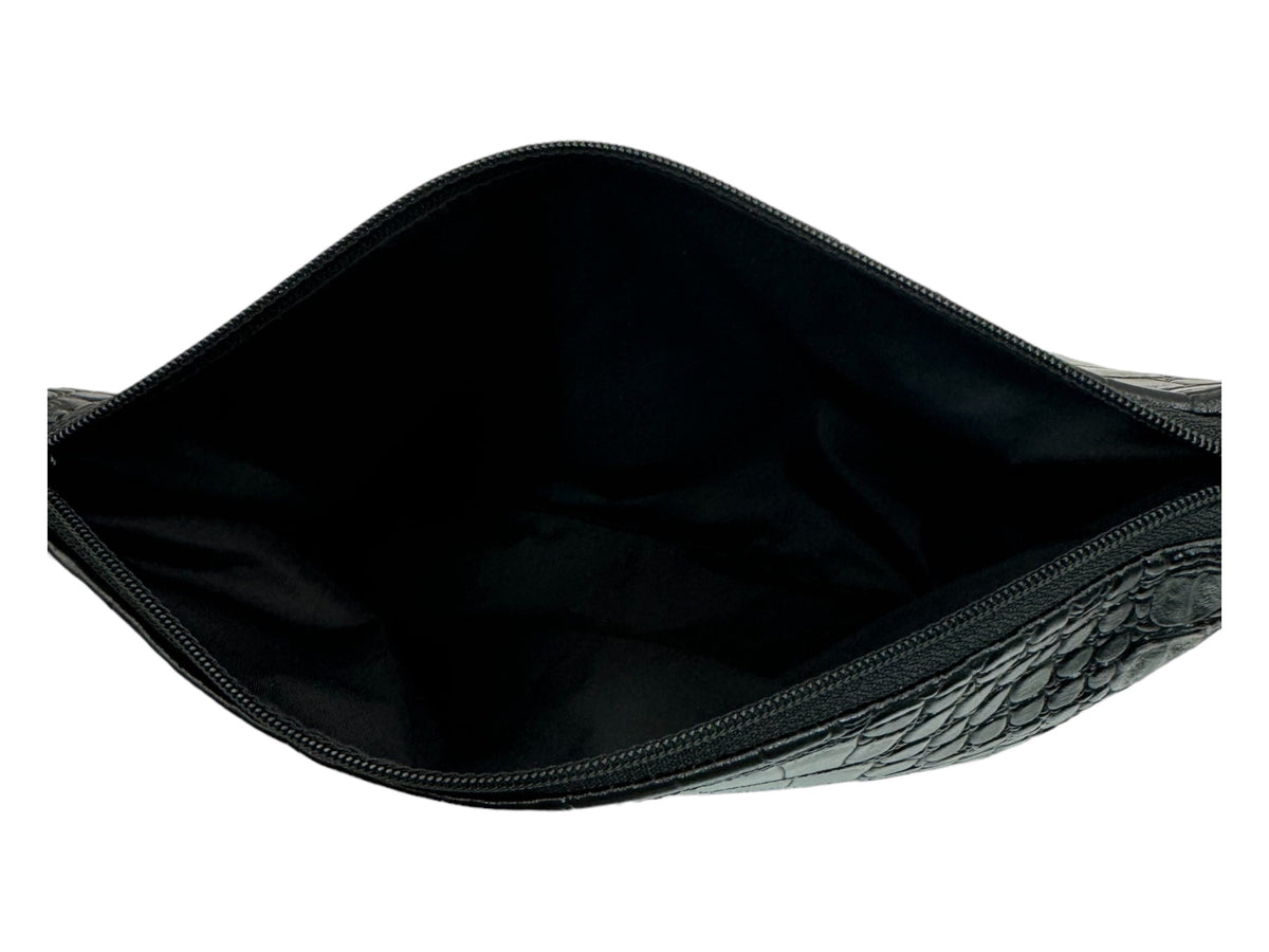 Top view of an open black faux crocodile cosmetic bag showing the spacious black interior, wide zippered opening, and textured exterior.